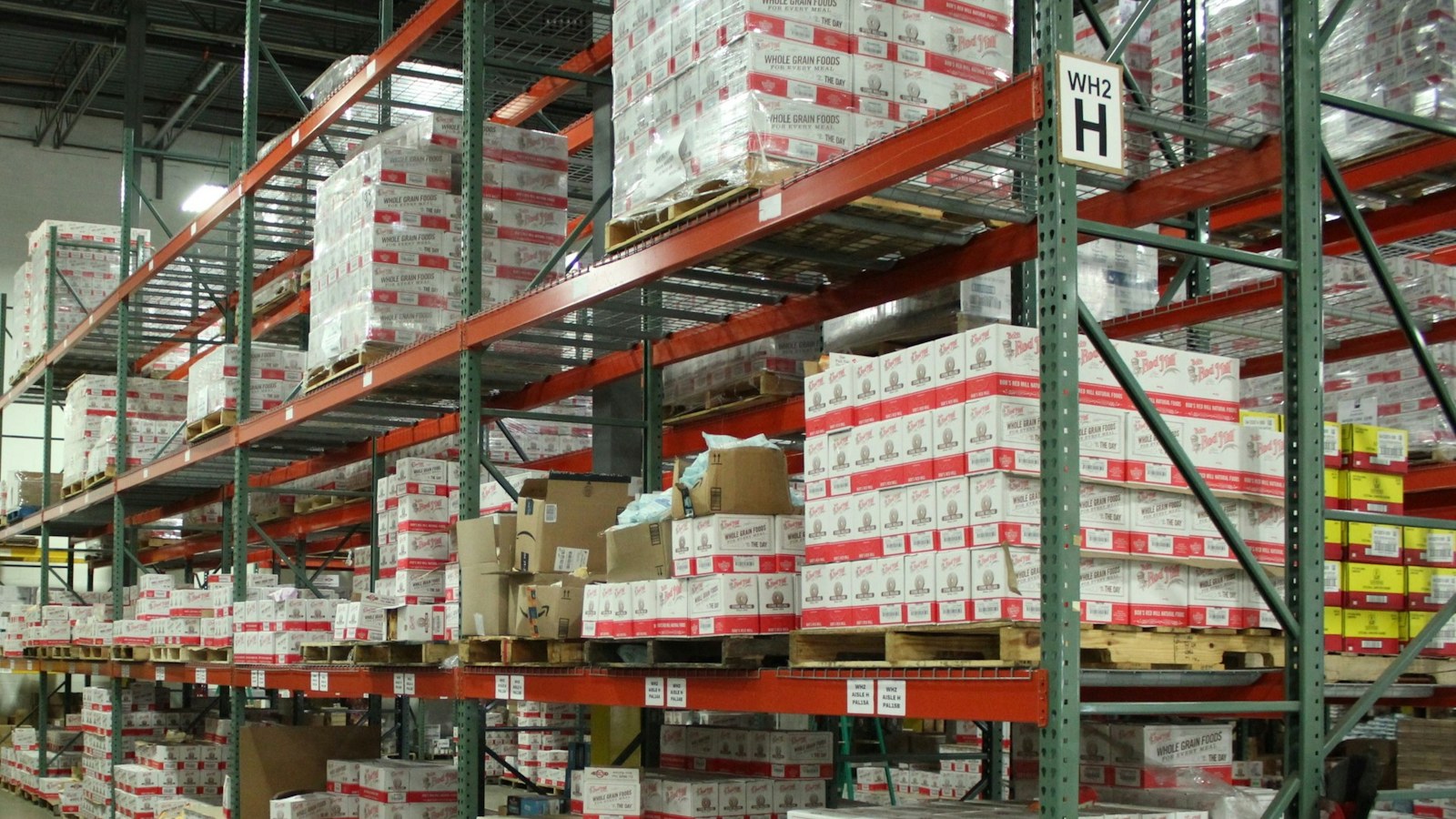 Boxes of goods on shelves in a distributor's warehouse